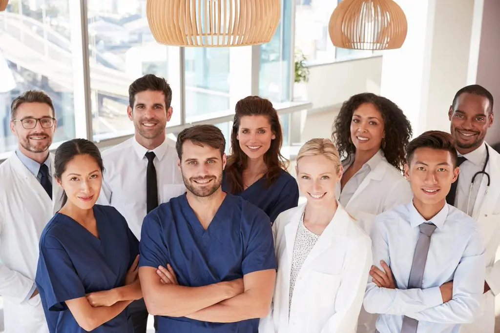 A group of doctors and nurses standing together.