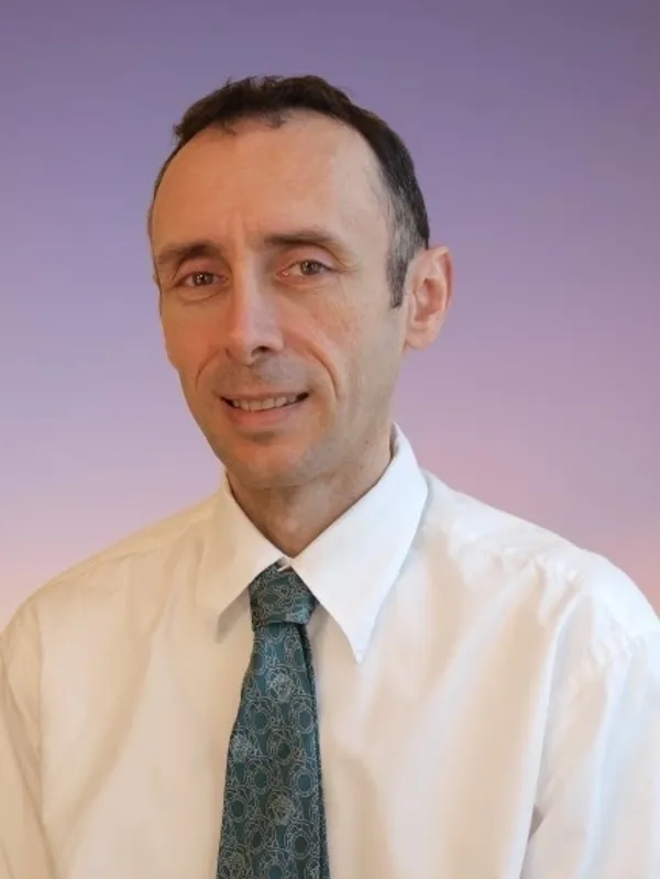 A man in a white shirt and tie